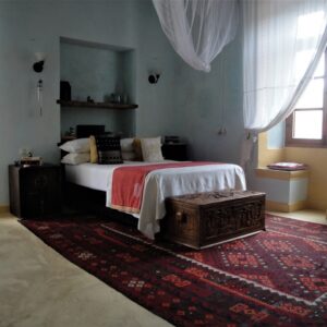 Jardim dos Aloes, Ilha de Mocambique — the Aloe Vera Relaxing Apartment bedroom, photograph from the property's official website