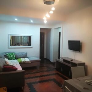 Sala de estar de um apartamento no Oasis Tropical, Beira