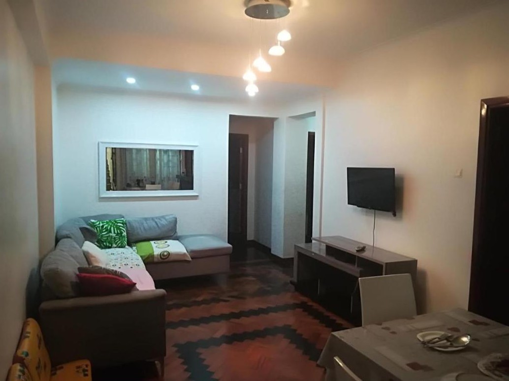 Sala de estar de um apartamento no Oasis Tropical, Beira